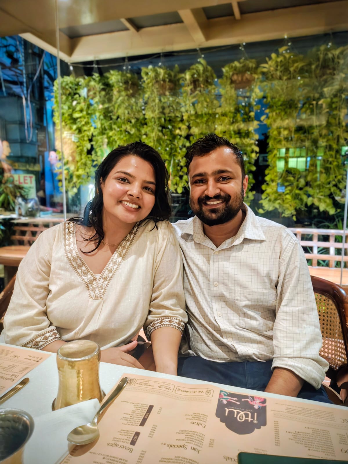 A romantic couple pose in black and white